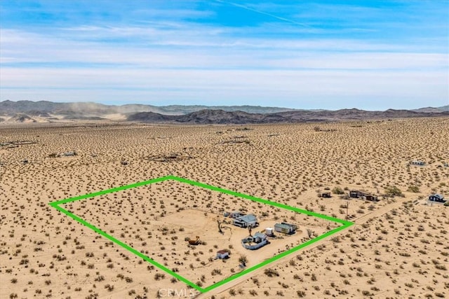 68365 Emerald Dr Unit 29, Palms, CA 92277 - aerial view of sparsely populated area featuring mountains, a desert landscape, and property boundaries highlighted