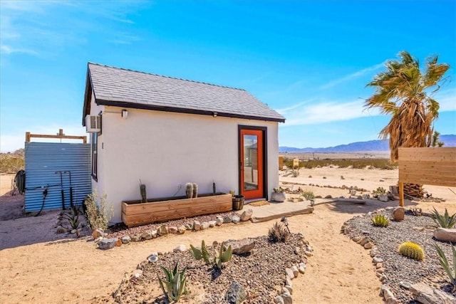68365 Emerald Dr Unit 29, Palms, CA 92277 - back of house featuring stucco siding and a mountain view