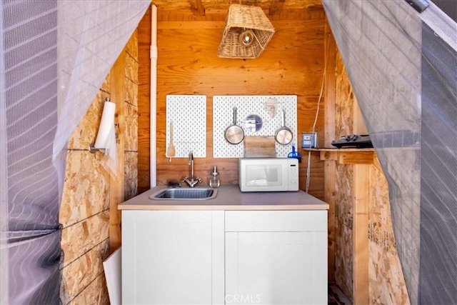 68365 Emerald Dr Unit 29, Palms, CA 92277 - washroom with a sink and wood walls