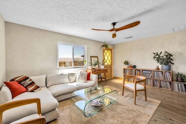 68365 Emerald Dr Unit 29, Palms, CA 92277 - living room with ceiling fan, wood finished floors, and a textured ceiling