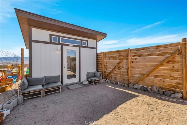 68365 Emerald Dr Unit 29, Palms, CA 92277 - view of outbuilding with a fenced backyard and a mountain view