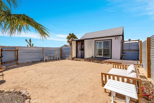 68365 Emerald Dr Unit 29, Palms, CA 92277 - rear view of house featuring a fenced backyard and stucco siding
