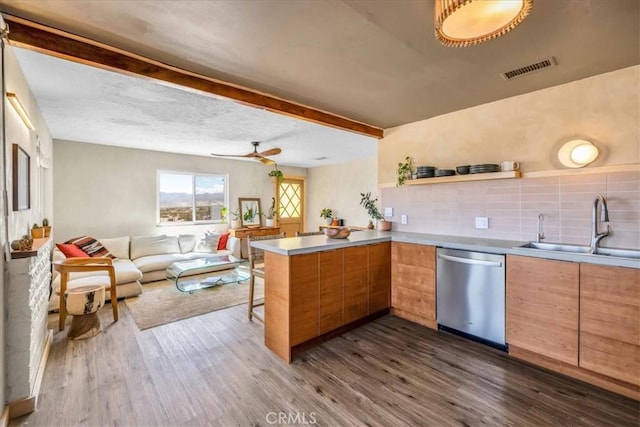 68365 Emerald Dr Unit 29, Palms, CA 92277 - kitchen featuring dishwasher, a sink, a peninsula, dark wood-style floors, and open floor plan