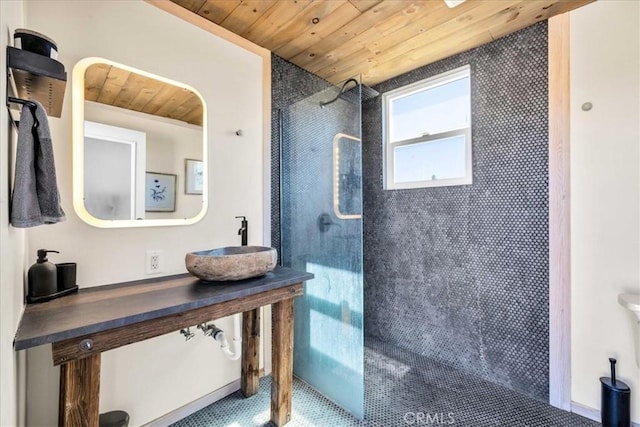 68365 Emerald Dr Unit 29, Palms, CA 92277 - bathroom featuring wood ceiling, a sink, and a walk in shower
