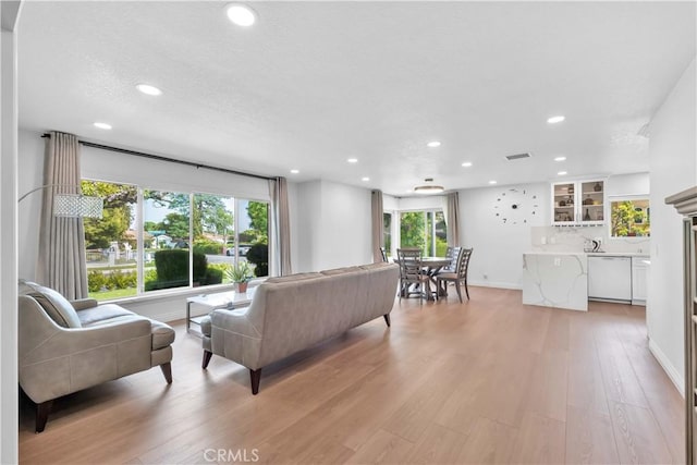 1931 El Sereno Ave, Arcadia, CA 91007 - living area featuring healthy amount of natural light, recessed lighting, light wood-style floors, and baseboards