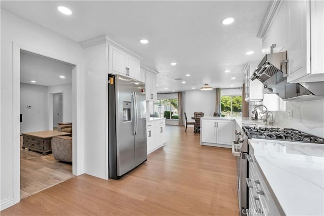 1931 El Sereno Ave, Arcadia, CA 91007 - kitchen featuring appliances with stainless steel finishes, recessed lighting, light wood-style floors, white cabinets, and light stone countertops