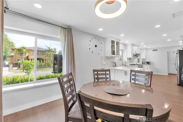 1931 El Sereno Ave, Arcadia, CA 91007 - dining room with light wood finished floors and recessed lighting