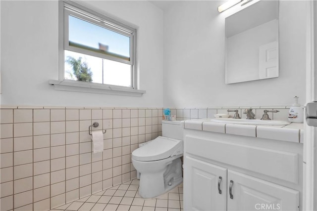 1931 El Sereno Ave, Arcadia, CA 91007 - half bath featuring tile walls, tile patterned floors, toilet, vanity, and a wainscoted wall