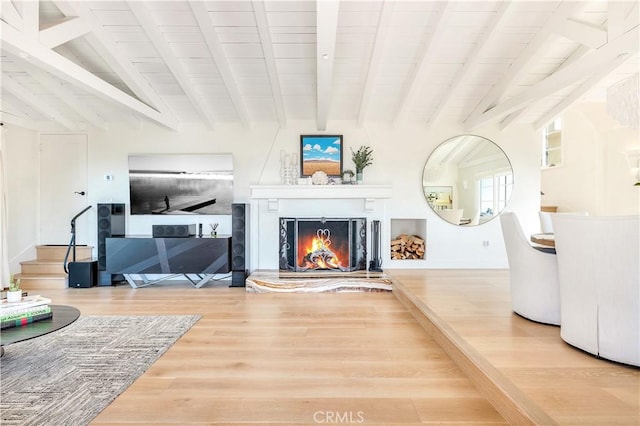 802 Rembrandt Dr, Laguna Beach, CA 92651 - living area featuring wood finished floors, beamed ceiling, a fireplace, and stairway