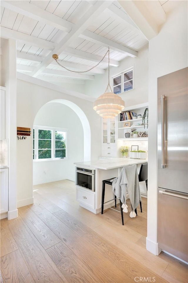 802 Rembrandt Dr, Laguna Beach, CA 92651 - kitchen with high end refrigerator, open shelves, light countertops, light wood finished floors, and wooden ceiling with exposed beams