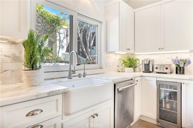 802 Rembrandt Dr, Laguna Beach, CA 92651 - kitchen with wine cooler, dishwasher, a sink, decorative backsplash, and white cabinetry