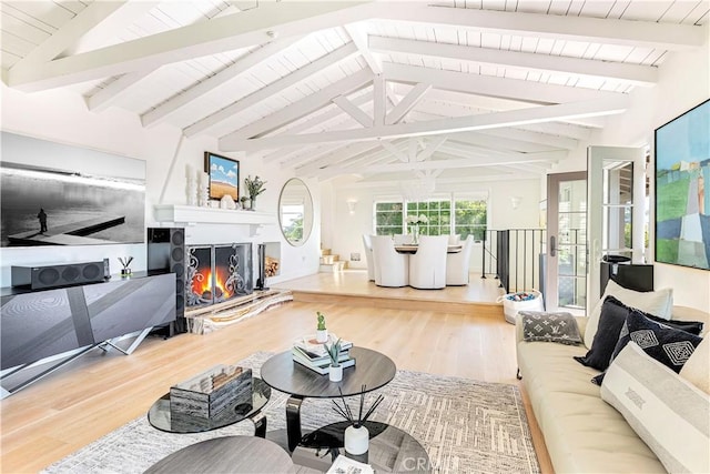 802 Rembrandt Dr, Laguna Beach, CA 92651 - living room featuring wood finished floors, wooden ceiling, and a lit fireplace