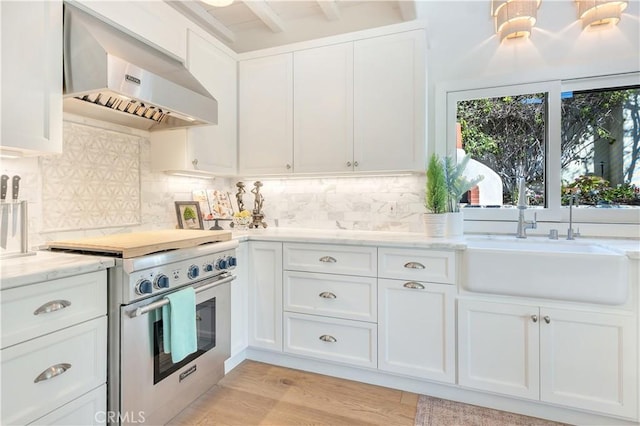 802 Rembrandt Dr, Laguna Beach, CA 92651 - kitchen with stainless steel stove, ventilation hood, white cabinets, a sink, and light stone countertops