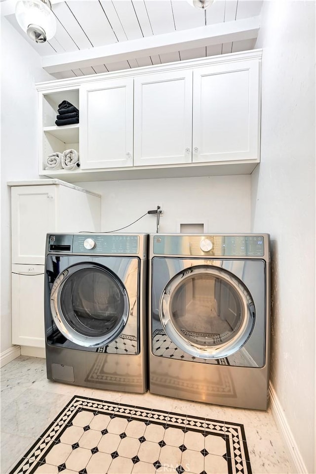 802 Rembrandt Dr, Laguna Beach, CA 92651 - laundry room featuring cabinet space, separate washer and dryer, and baseboards