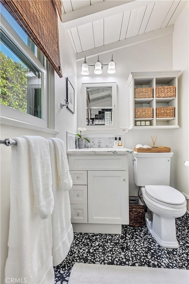 802 Rembrandt Dr, Laguna Beach, CA 92651 - bathroom with toilet, vanity, and beamed ceiling
