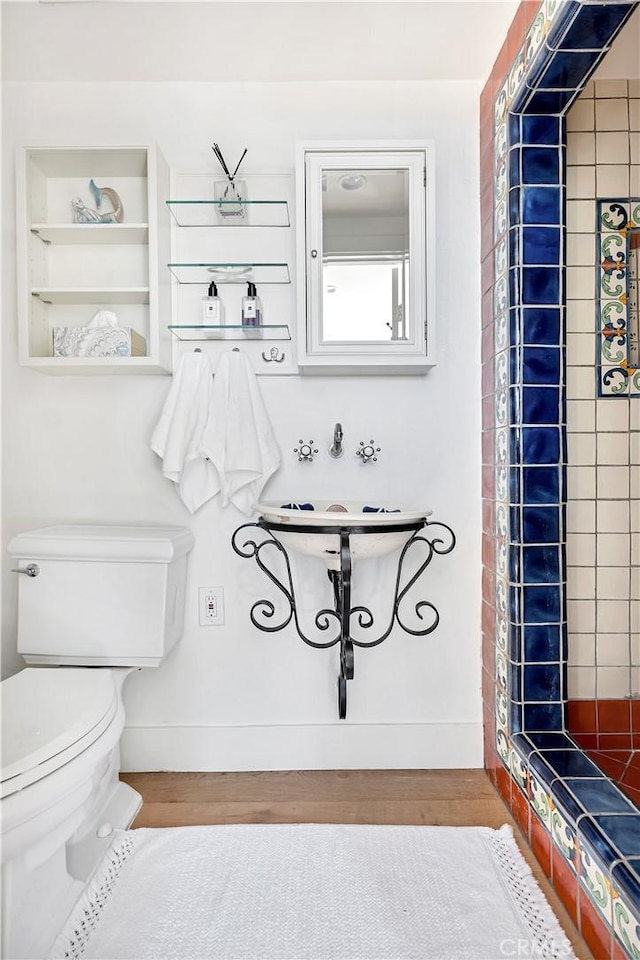 802 Rembrandt Dr, Laguna Beach, CA 92651 - bathroom with toilet, baseboards, a shower, and wood finished floors
