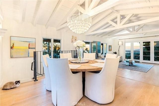 802 Rembrandt Dr, Laguna Beach, CA 92651 - dining area featuring french doors, light wood-style floors, and a chandelier