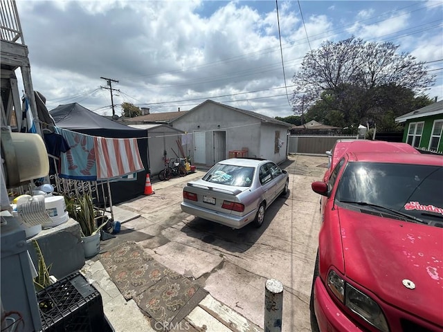 1212 E 54th St, Los Angeles, CA 90011 - view of property exterior with a patio and an outdoor structure