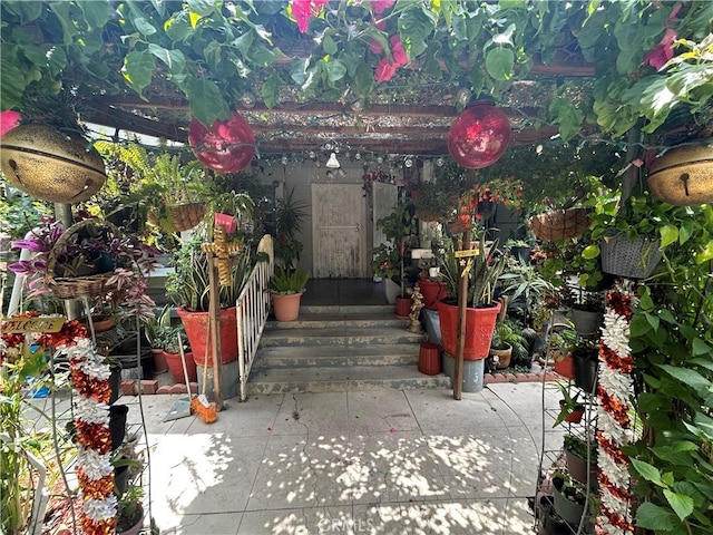 1212 E 54th St, Los Angeles, CA 90011 - view of exterior entry with a pergola