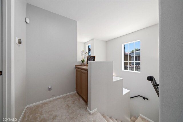 16741 Tim Ln, Van Nuys, CA 91406 - hallway featuring light colored carpet, an upstairs landing, and baseboards