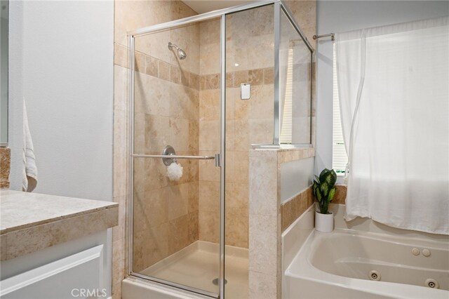 16741 Tim Ln, Van Nuys, CA 91406 - bathroom featuring a tub with jets and a stall shower