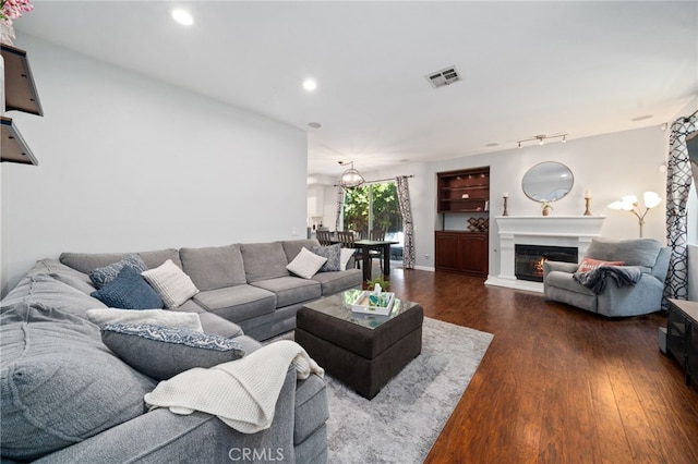 16741 Tim Ln, Van Nuys, CA 91406 - living room with wood finished floors, recessed lighting, and a glass covered fireplace