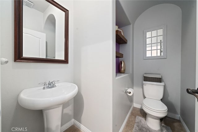16741 Tim Ln, Van Nuys, CA 91406 - half bathroom featuring toilet, tile patterned floors, and baseboards
