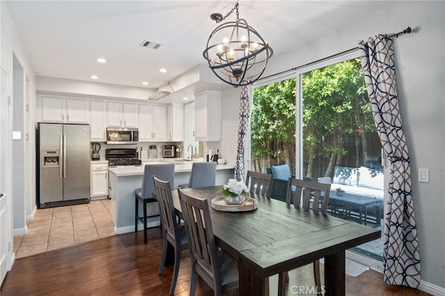 16741 Tim Ln, Van Nuys, CA 91406 - dining room with a chandelier, recessed lighting, baseboards, and light wood-style flooring