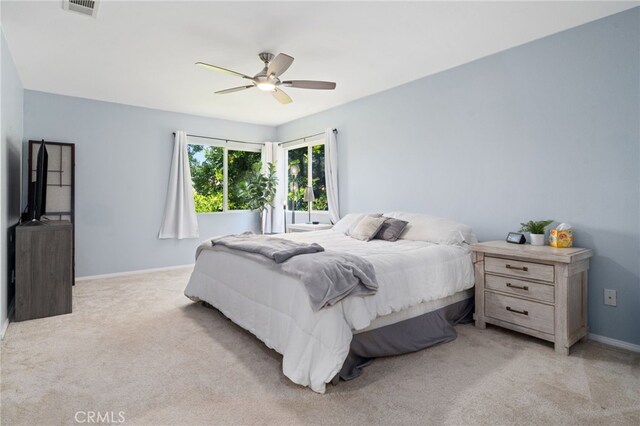 16741 Tim Ln, Van Nuys, CA 91406 - bedroom with light carpet, baseboards, and a ceiling fan