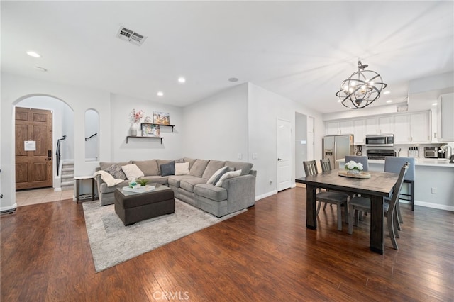 16741 Tim Ln, Van Nuys, CA 91406 - living area featuring arched walkways, wood finished floors, recessed lighting, a chandelier, and baseboards