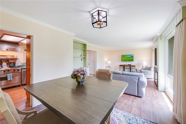1200 N Cypress St, La Habra Heights, CA 90631 - dining room featuring light wood-style flooring, crown molding, and a chandelier