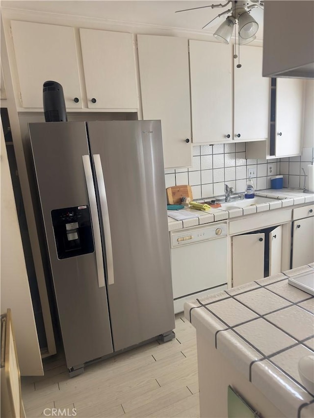 3749 Lockland Dr Unit B, Los Angeles, CA 90008 - kitchen with stainless steel refrigerator with ice dispenser, tile counters, dishwasher, white cabinets, and ceiling fan