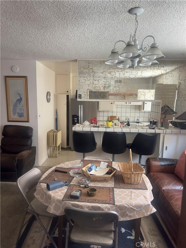 3749 Lockland Dr Unit B, Los Angeles, CA 90008 - dining area with a textured ceiling and a chandelier
