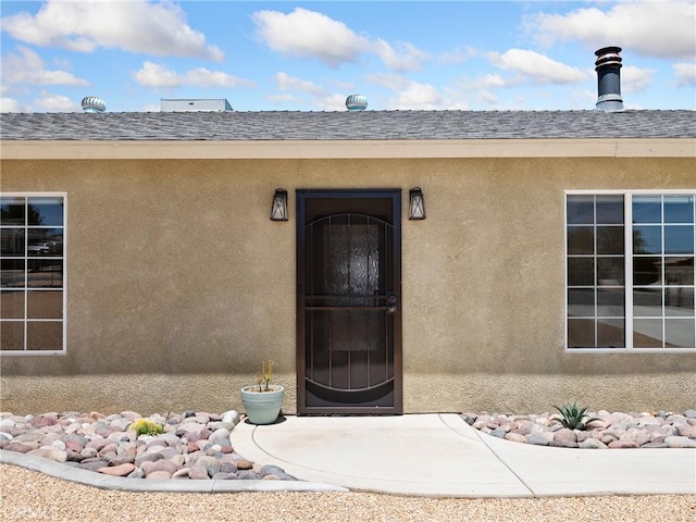 17970 Pitache St, Hesperia, CA 92345 - property entrance featuring stucco siding and roof with shingles