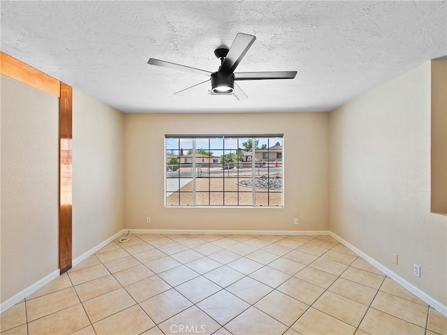 17970 Pitache St, Hesperia, CA 92345 - spare room featuring light tile patterned floors, ceiling fan, a textured ceiling, and baseboards