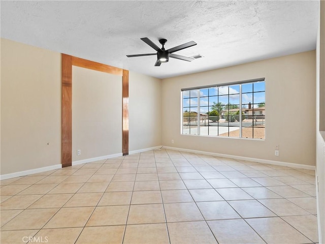 17970 Pitache St, Hesperia, CA 92345 - unfurnished room featuring a textured ceiling, ceiling fan, baseboards, and light tile patterned floors