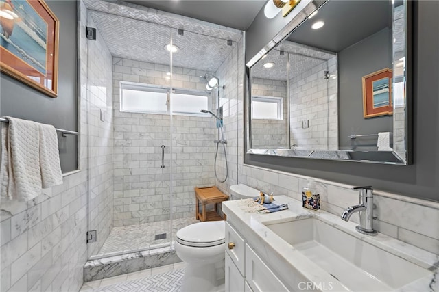 31751 E Nine, Laguna Niguel, CA 92677 - full bathroom with tile walls, toilet, healthy amount of natural light, a shower stall, and vanity
