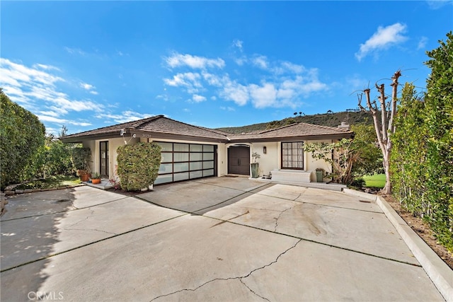 31751 E Nine, Laguna Niguel, CA 92677 - view of front of house featuring stucco siding, an attached garage, and concrete driveway
