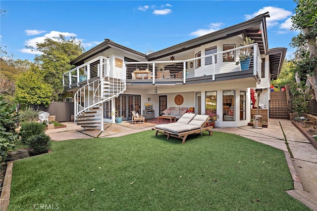 31751 E Nine, Laguna Niguel, CA 92677 - rear view of property featuring a balcony, stairs, a patio, outdoor lounge area, and stucco siding