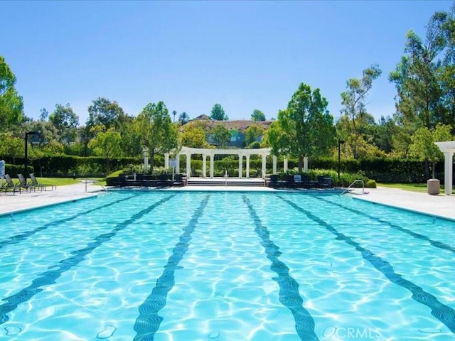 27718 Heartwood Ct, Valencia, CA 91354 - community pool with a pergola and view of scattered trees
