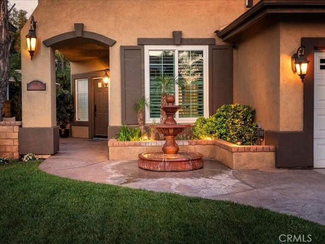 27718 Heartwood Ct, Valencia, CA 91354 - view of exterior entry with stucco siding