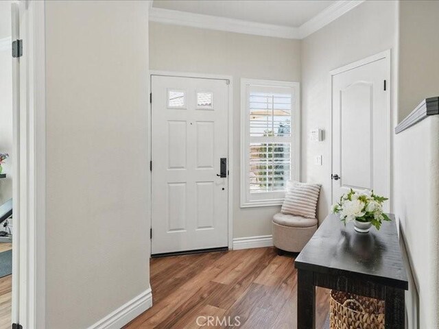 27718 Heartwood Ct, Valencia, CA 91354 - foyer featuring crown molding, wood finished floors, and baseboards
