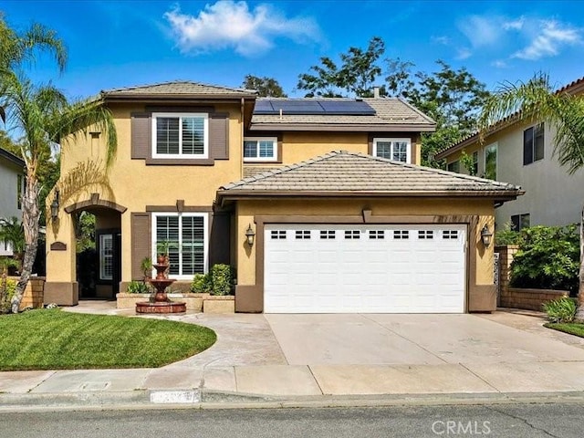 27718 Heartwood Ct, Valencia, CA 91354 - traditional-style house with stucco siding, a garage, roof mounted solar panels, concrete driveway, and a tiled roof