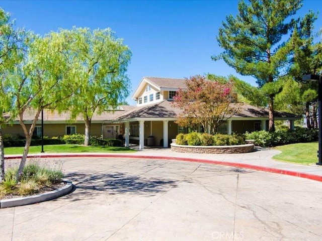 27718 Heartwood Ct, Valencia, CA 91354 - view of front facade featuring a tiled roof, curved driveway, and a front yard