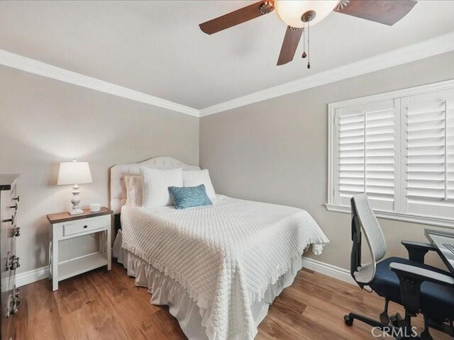 27718 Heartwood Ct, Valencia, CA 91354 - bedroom with crown molding, baseboards, wood finished floors, and ceiling fan