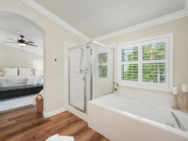 27718 Heartwood Ct, Valencia, CA 91354 - full bath featuring connected bathroom, ornamental molding, a stall shower, a bath, and wood finished floors