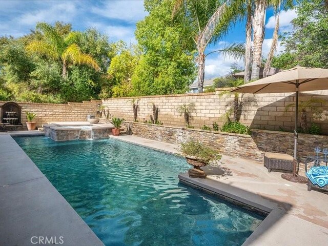 27718 Heartwood Ct, Valencia, CA 91354 - view of swimming pool with a patio area, a fenced backyard, and a pool with connected hot tub