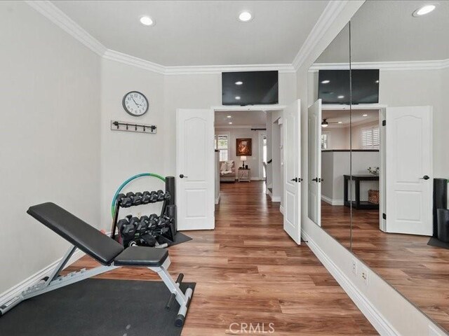 27718 Heartwood Ct, Valencia, CA 91354 - workout area with crown molding, wood finished floors, recessed lighting, baseboards, and french doors