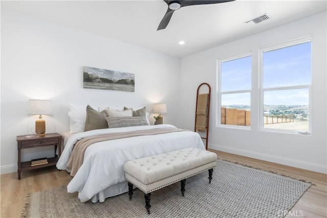 13165 N Bluffs Ct, San Miguel, CA 93451 - bedroom featuring baseboards, light wood finished floors, multiple windows, and recessed lighting