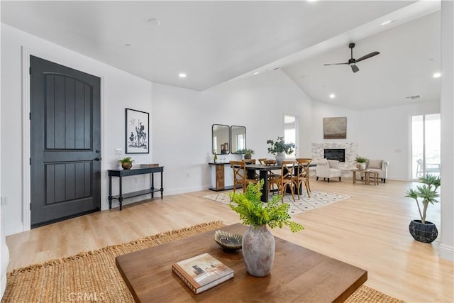 13165 N Bluffs Ct, San Miguel, CA 93451 - living area with a fireplace, light wood finished floors, recessed lighting, ceiling fan, and baseboards